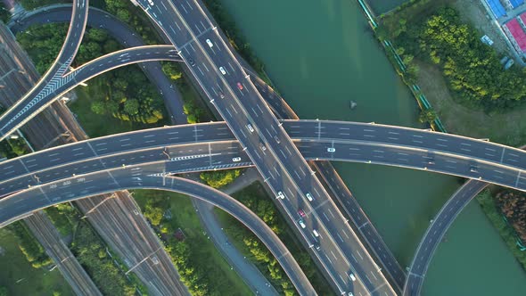 Aerial Drone View of Highway Multi-level Junction Road with Moving Car at Sunset,Active Movement  alt
