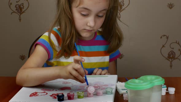 Closeup of a Girl Drawing with Colored Paints on Paper alt