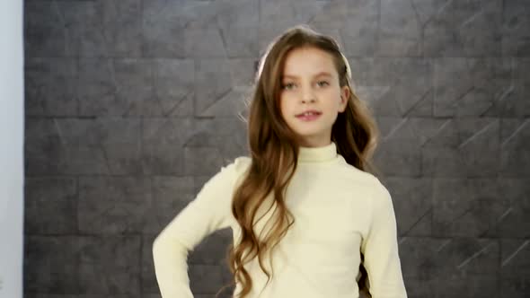 Pretty Little Girl in White Sleeveless Shirt Shorts and Hat alt