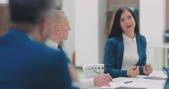 Beautiful Young Woman Talks About a New Financial Project Business Plan alt