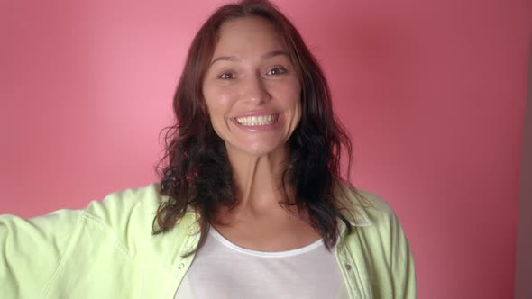 Portrait of Young Woman with Thumbs Up alt