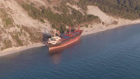 The Ship Ran Aground. Environmental Pollution at Sea. Aerial View. Grounded Ship. Drone Footage alt
