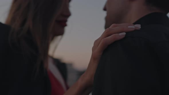 Couple in Love on a Romantic Date Dancing on the Roof of a Building at Sunset
