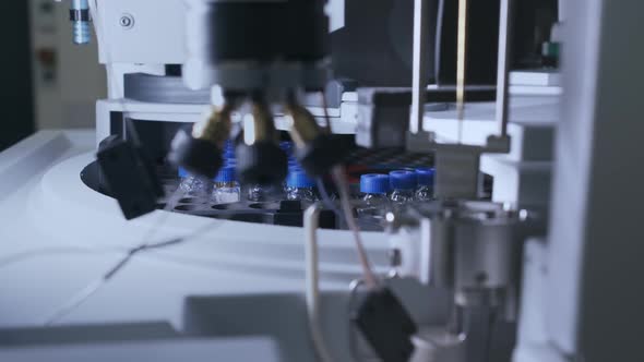 Close Up Auto Sampler Collects Sample for HPLC Analysis alt