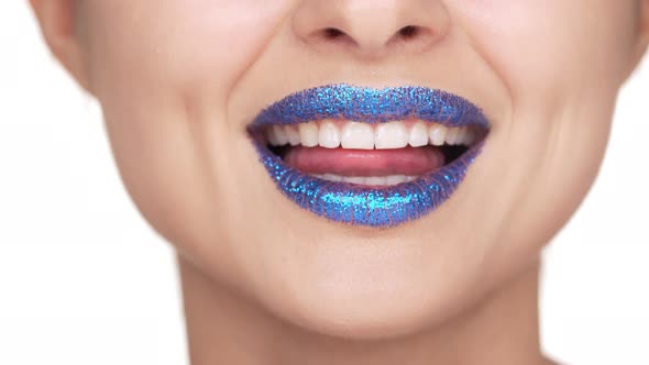 Headshot of Seductive Female Face Having Flirty Emotions and Bright Lipgloss Licking Teeth and Lips alt