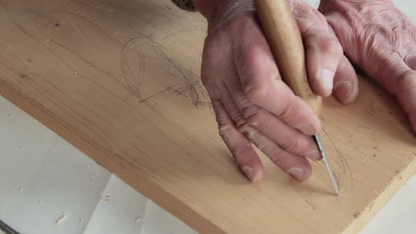 Closeup shoot of a woodcarver at work