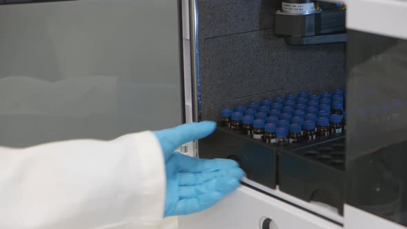 Analytical Chemist Takes a Vials To Auto Sampler of HPLC System alt