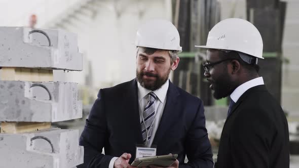 Factory manager showing guest ferroconcrete items