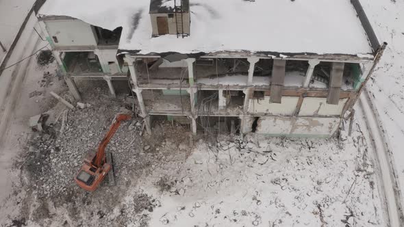 Aerial View Excavators Dismantle The Concrete Structures Of The Building alt