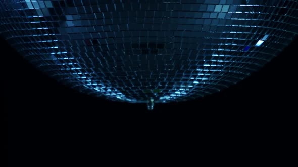 Mirror Disco Ball Close Up in the Center of a Spin on a Black Background alt