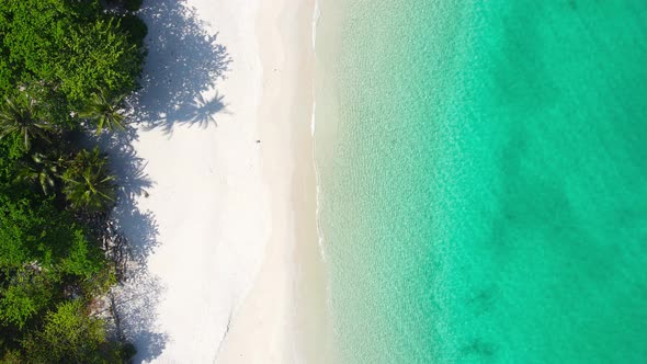 Aerial video beautiful closeup shot beach and seawater on crystal water wave on sand in sunset time alt