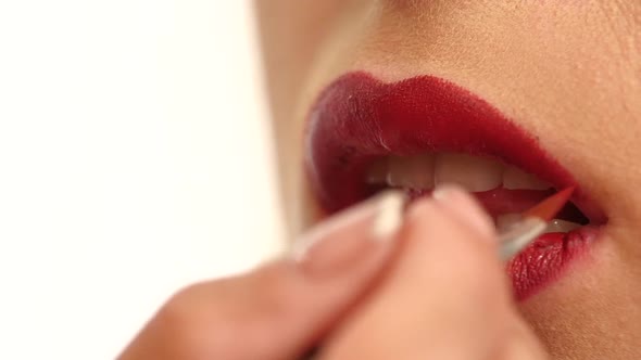 Woman's Face with Fashion Red Lips Makeup. Slow Motion alt