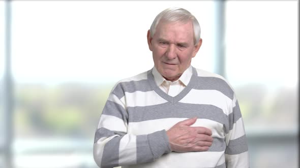Sad Senior Man Having Heart Cramps alt