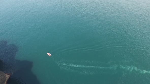 Aerial View Of Floating Speed Boat At Jeju Island In South Korea alt