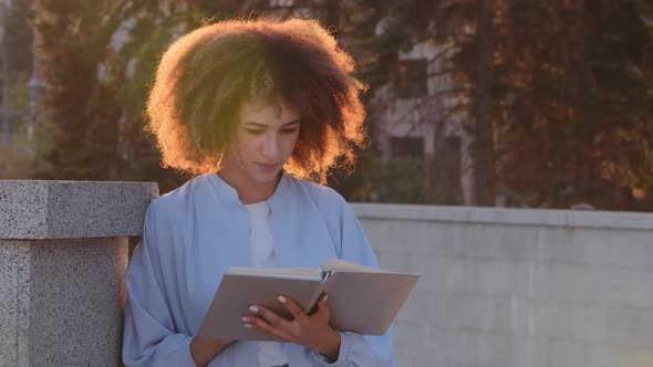 Female Portrait Outdoors African American Lady Girl Student Afro Woman Outdoor in Sun Sunlight Reads alt