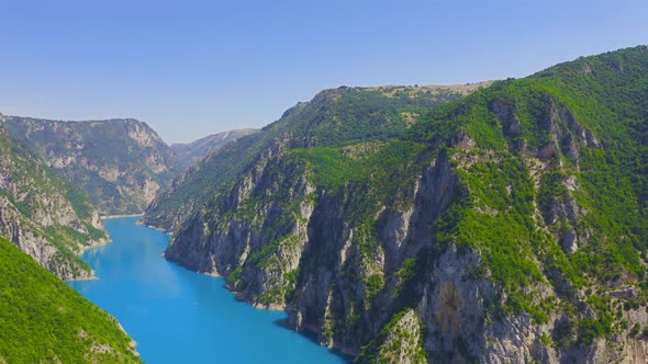 Aerial view on turquoise water in a mountain lake. alt