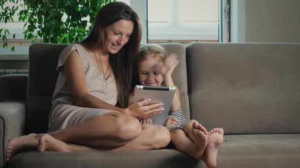 Mom and daughter with a tablet