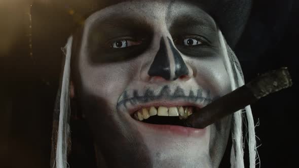 Close Up Shot of Creepy Man Face with Skeleton Makeup Smoking Cigar, Making Faces, Looking at Camera alt