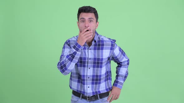 Young Handsome Hispanic Man Looking Shocked alt