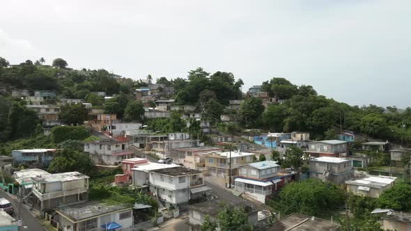 Drone shot up hill of Puerto Rican Neighborhood shot in 4k 24p alt