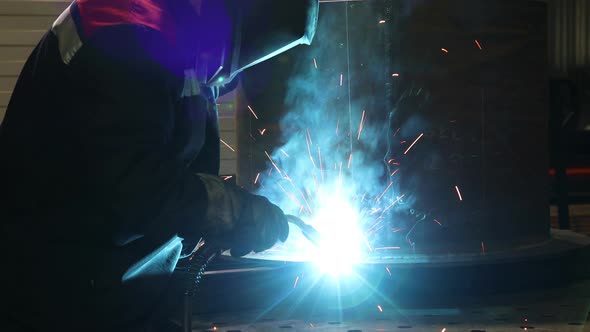 Welder at Work in The Production Shop 