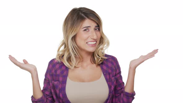 Portrait of Caucasian Longhaired Woman with Hazel Eyes Helplessly Throwing Up Hands Meaning Oops alt