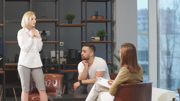 Young Couple Visiting Professional Psychologist Office. alt