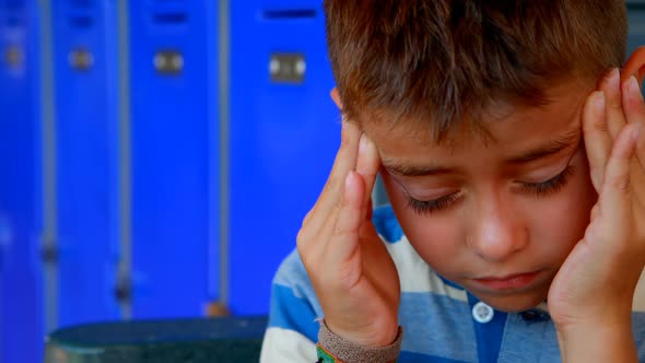 Schoolboy suffering from headache 4k alt