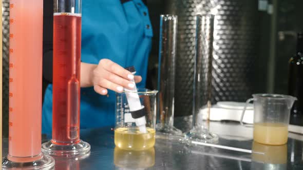 Scientist Pouring Wine Product Liquid Into Test Tube Quality Control alt