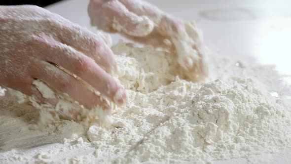 Kneading dough. Preparation of dough for baking bread, pizza close-up