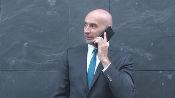 Confident Businessman Wearing Suit alt