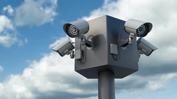 Surveillance Cctv Security Cameras Against Timelapse Skyline alt