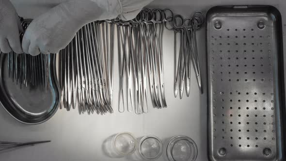 Nurse Preparing Sterile Surgical Instruments Healthcare Worker Prepares Tools alt