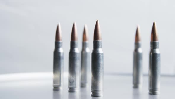 Cinematic rotating shot of bullets on a metallic surface - BULLETS 022 alt