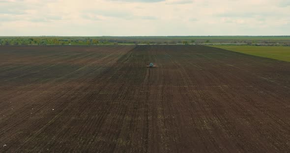 Rusty Tractor is Plowing Land View From Drone of Agricultural Fields in Seeding Season  Prores