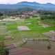 Aerial landscape with the expanse of rice fields, settlements and hills in Sumedang, West Java - VideoHive Item for Sale