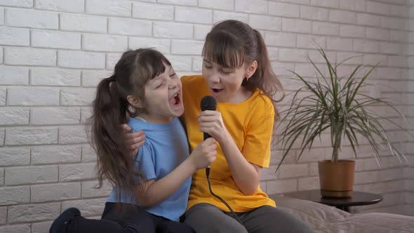 Children with a microphone.  alt