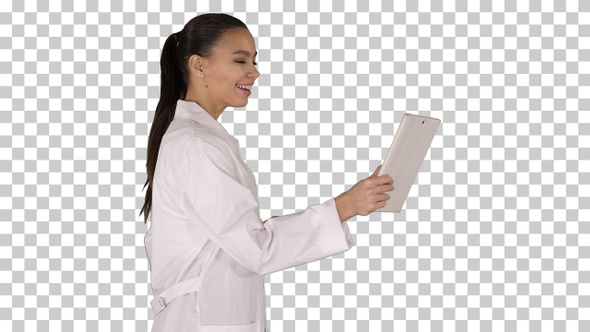 Young woman doctor holding tablet in her hands and making video alt