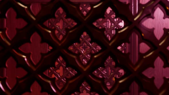 Seamless looping animation of a wooden screen in a confessional booth in church. alt