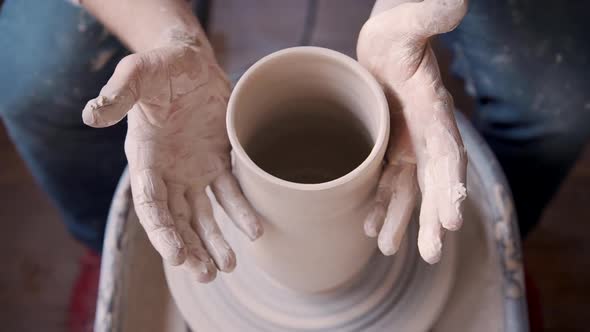 Artisan Working with Clay in Pottery Workshop Studio