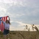 Happy Patriotic Young Woman Spins with the US Flag and Jumps Into the Field - VideoHive Item for Sale