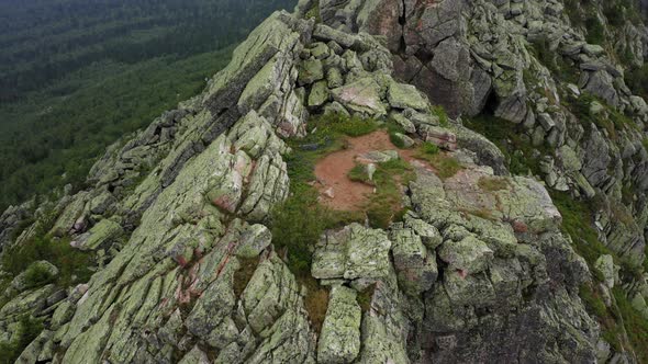 Aerial View Drone Moving Near a Rocky Cliff