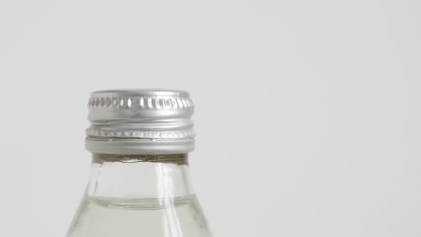 Water bottle made of glass close-up 4K  tilting footage