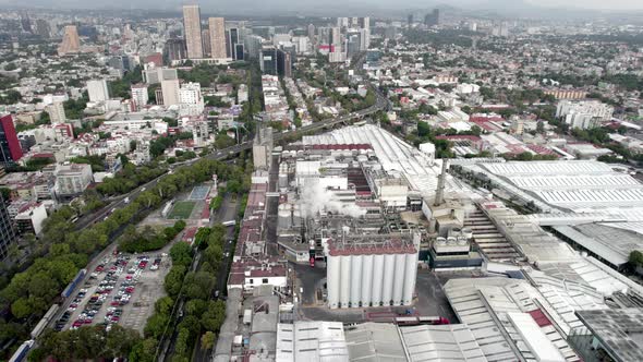 drone shot of beer factory producing in the morning alt