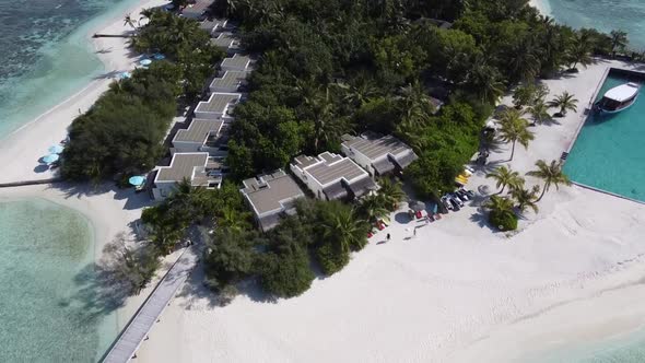 Aerial View of a Tropical Paradise Island Bay Covered in Limestone Trees with Crystal Clear Beach