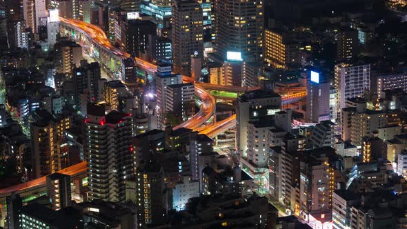 time lapse of the Metropolitan Expressway junction road and city at night, Tokyo, Japan alt
