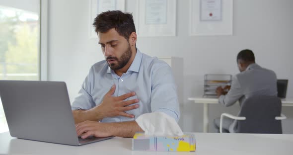Unhealthy Male Employee Coughing Having Ache in Chest Working in Office alt