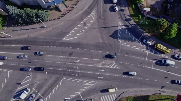 Drone Rises Above the Intersection of the Roads in a Suburb alt
