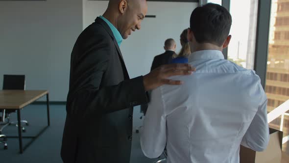 Confident African Boss Entrepreneur CEO Help Male and Female Colleagues. alt