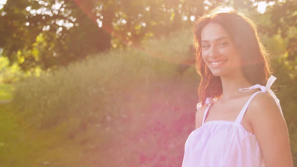 Portrait of Happy Smiling Woman at Summer Park alt
